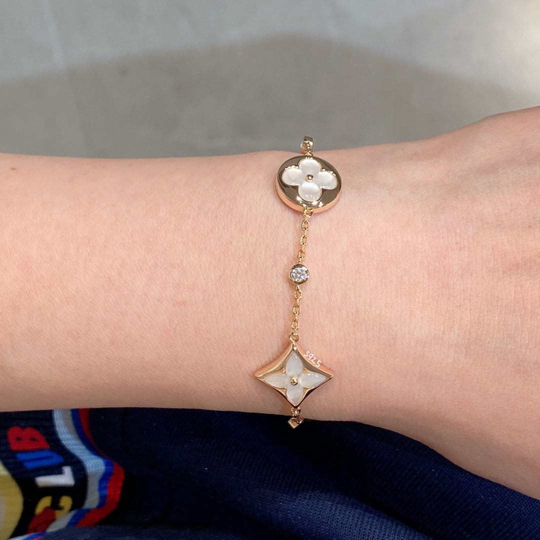 [Regal Jewels]STAR AND SUN 4 MOTIF WHITE MOP PINK GOLD BRACELET