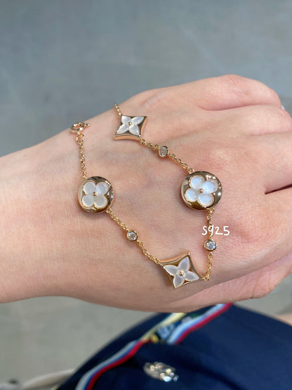 [Regal Jewels]STAR AND SUN 4 MOTIF WHITE MOP PINK GOLD BRACELET