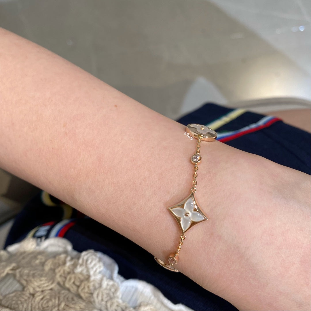 [Regal Jewels]STAR AND SUN 4 MOTIF WHITE MOP PINK GOLD BRACELET
